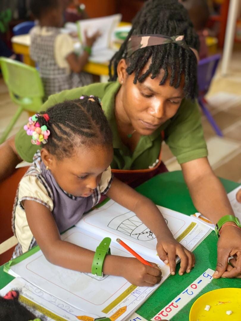 An Atlantic Academy teacher giving a pupil individual support